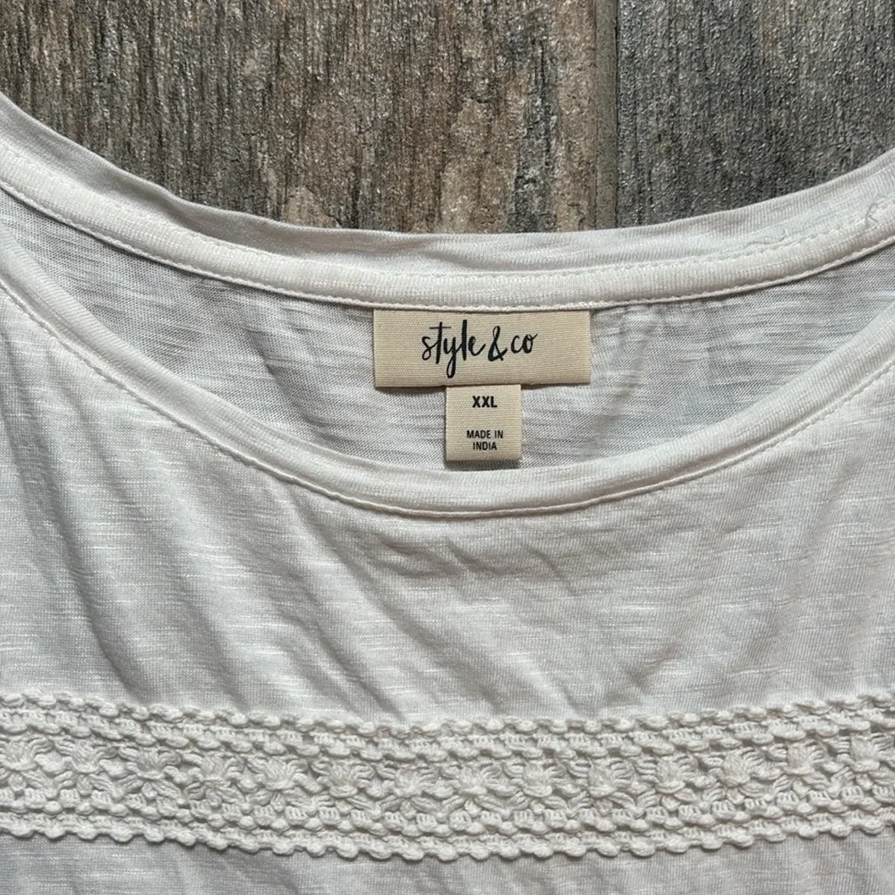 Style & Co white tee with stripes of fringe and crochet